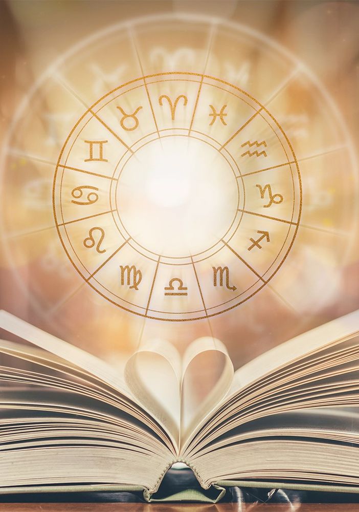 libro aperto e segni zodiacali
